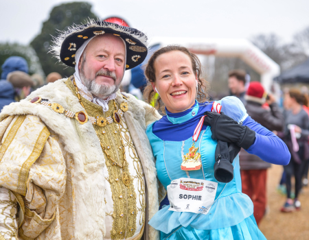 A man dressed as Henry VIII and a woman in fancy dress